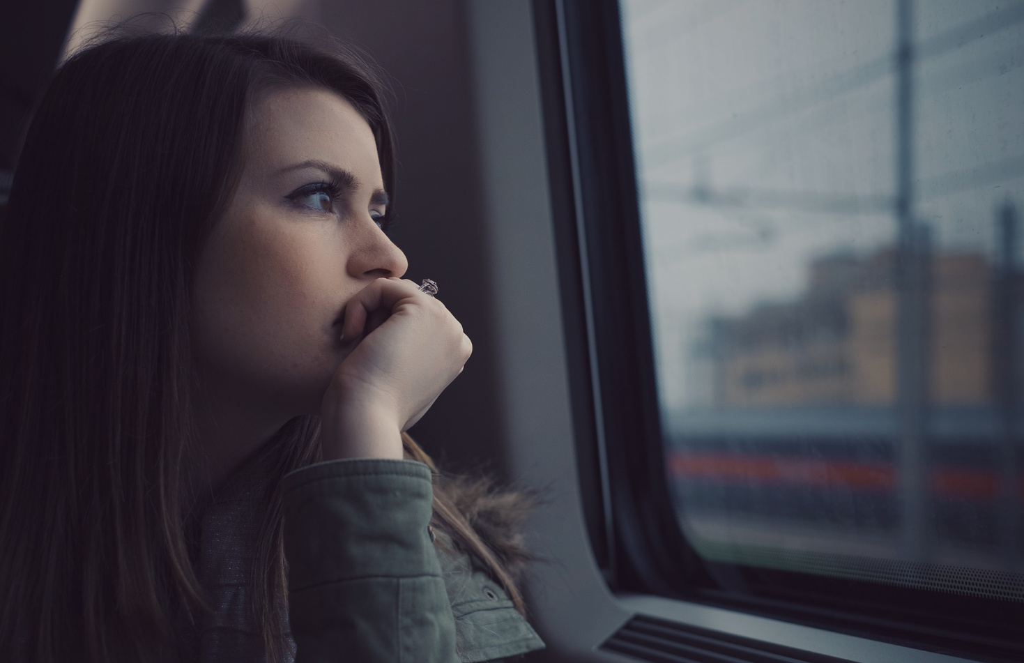 Woman Looking Out the Window